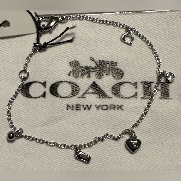 Coach New NWT silver tone chain charm bracelet featuring multiple charms - Picture 4 of 5